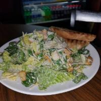 Caesar Salad · Romaine lettuce, croutons and Parmesan cheese with Caesar dressing.