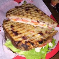 Chicken Salad Panini · Our gourmet chicken salad on a cranberry pecan bread with lettuce, tomatoes and Swiss cheese...