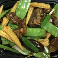 Shanghai Boneless Duck · Roasted duck stir-fried with snow pea pods, black mushroom and baby corn in Shanghai spicy s...