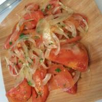 Chilena Salad · Peeled tomato, onions and cilantro.