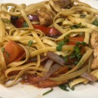 Tallarin Saltado · Chicken spaghetti stir-fry. Diced chicken, red onions, tomato, bell peppers and spaghetti.