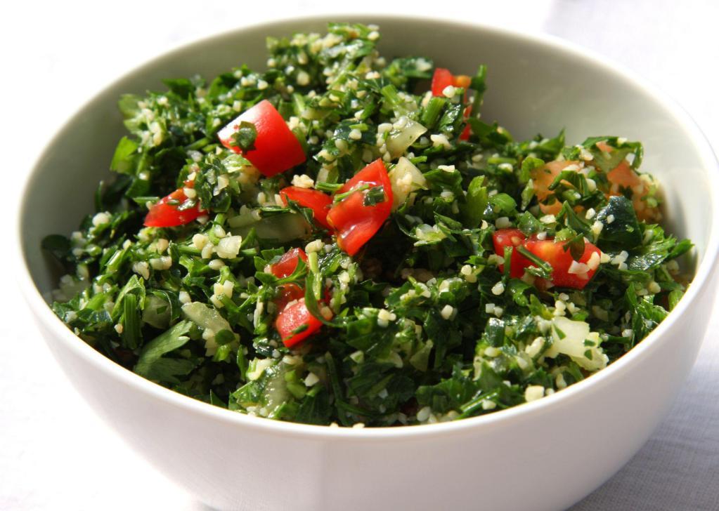 Tabouli  · Chopped Italian parsley, tomatoes, onions mixed with bulgar dressed with lemon juice, feta cheese and olive oil.  