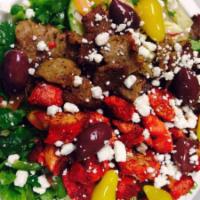 Combination Salad · Slices of marinated lamb, steak, and chicken over Greek salad, fresh lettuce, onions, tomato...