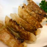 2. Gyoza · 6 pieces. Pan fried dumplings, choice of pork or vegetable.