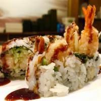 Shrimp Tempura Roll · Shrimp tempura and cucumber wrapped inside out with sesame seed with eels sauce on top