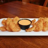 Blazing Onion Petals · Freshly beer battered and served with sriracha aioli.