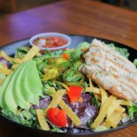 Southwest Chicken Salad · All-natural chicken breast, fresh greens, black beans, diced tomato, corn tortilla chips, an...
