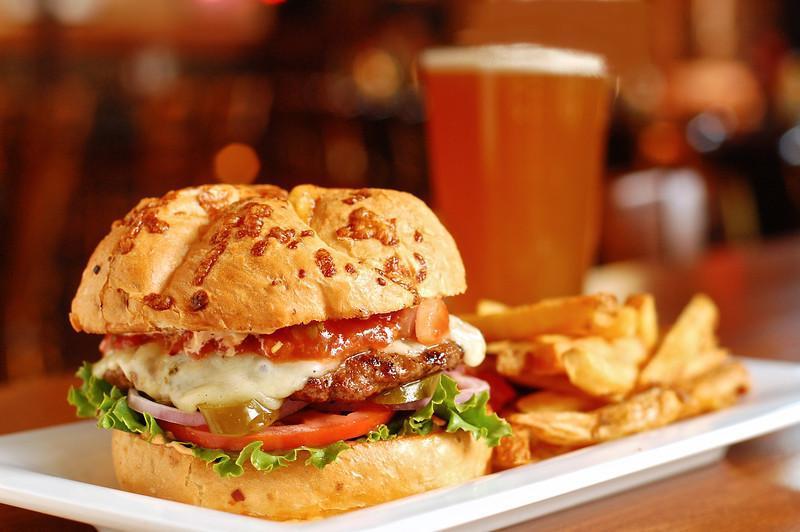 Texas Heat Burger · Pepper Jack cheese, jalapeno peppers, house-made salsa, blazing sriracha sauce, lettuce, tomato, onion, and chipotle mayo on onion-cheese kaiser. Served with choice of side.