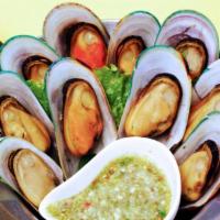 8. Steamed Mussels · Pot of steamed mussels, lemongrass and mint leaves. Served with spicy homemade dipping sauce.