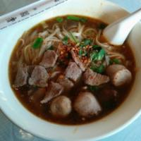 56. Boat Noodle Soup · Rice noodle soup with sliced beef ball and bean sprouts in a delicious beef broth.