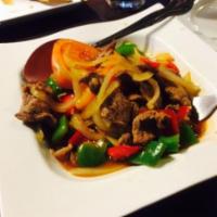 84. Mongolian Beef a la Carte · Beef sauteed with bell pepper, onion and tomato.