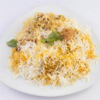 Goat Biryani · Long grain rice cooked in a sealed pot with pieces of goat meat marinated with exotic spices.