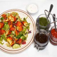 Chicken Tikka Salad · Boneless chicken tikka served over bed of mixed green salad with house dressing. Gluten-free.
