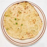 Aloo Parantha · Paratha stuffed with mildly spiced potatoes and peas, baked in the tandoor. Vegan.