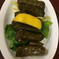 Grape Leaves · 6 pieces stuffed with seasoned rice and vegetables cooked in olive oil and lemon.
