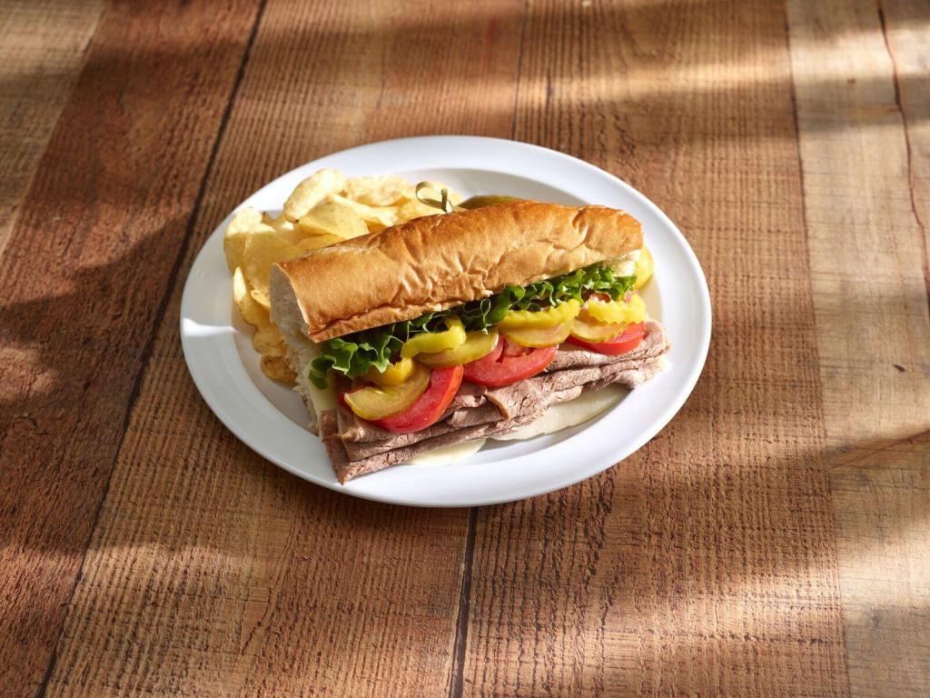 Roast Beef Sub · Roast beef and cheese. Served with lettuce, onions, tomatoes, pickles, peppers, cheese, Italian dressing, pickle spear and chips.