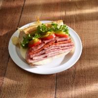 New Yorker Sub · Ham, salami, pepperoni, capicola, provolone, onions, lettuce, tomatoes, pickles and mayo.