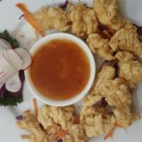 8. Fried Calamari · Deep fried calamari with Thai herbs served with plum sauce.