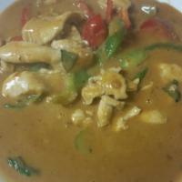 26. Panang Curry · Panang curry with coconut milk, peanut sauce, citrus leaves, bell peppers and fresh basil le...