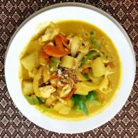 29. Yellow Curry · Yellow curry with coconut milk, potatoes, onions, carrots, green peas and bell peppers. Spicy.