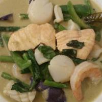 55. Green Curry Seafood · Simmered prawns, fresh fish, scallops, squid in coconut milk, green curry sauce, bell pepper...