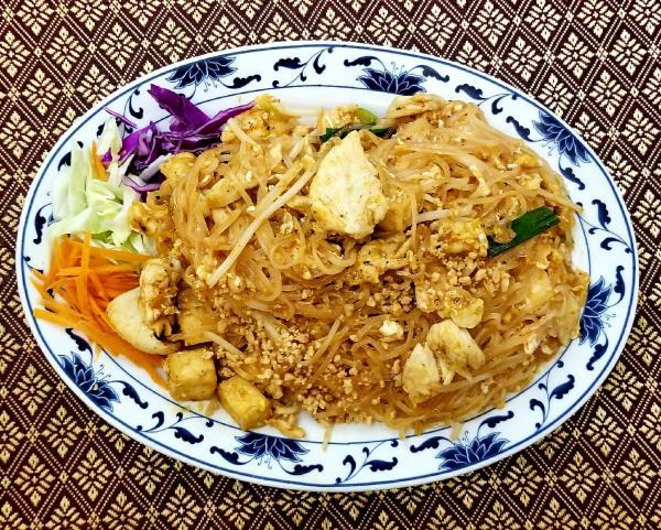 67. Pad Thai · Pan fried Thai noodles with chicken or prawn, fried tofu, ground peanuts, dried radish, bean sprouts, egg and onions.