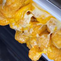 Cheesy Tots · A Wangs Sized portion of tater tots, with a generous helping of our mixed cheese blend