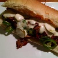Ruckus Brisket Philly Sandwich · Slow roasted brisket, caramelized red onions, jalapeno mornay and thinly sliced fresh jalape...