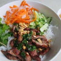 Grilled Pork over Vermicelli Bowl · Bun thit nuong. Thinly sliced grilled pork over vermicelli, lettuce, cucumber and bean sprou...