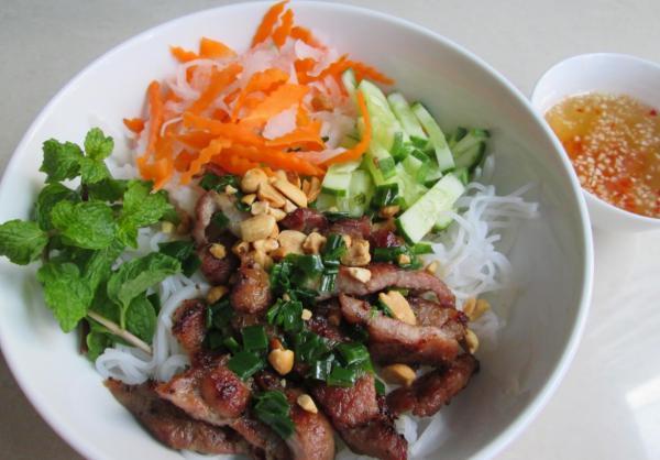 Grilled Pork over Vermicelli Bowl · Bun thit nuong. Thinly sliced grilled pork over vermicelli, lettuce, cucumber and bean sprouts, topped with peanuts and green onion.