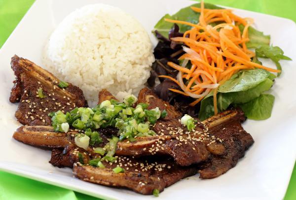Kalbi Bowl · BBQ beef ribs. Korean kalbi BBQ ribs served with organic mixed spring salad with homemade dressing over rice.