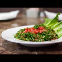 Tabbouleh Salad · Parsley, tomatoes, onions, bulgur (cracked wheat), mint, lemon juice, and olive.