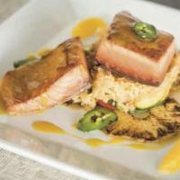Salmon Tropical · Salmon fillet in a passion habanero glaze garnished with a perico relish. Served with a side...