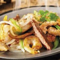 Texas Fajita · Grilled steak, chicken and shrimp. All fajitas are served in a sizzling skillet with grilled...