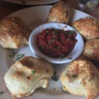 Pepperoni Pizza Bombs · Our pizza dough stuffed with pepperoni and mozzarella, brushed with our special Italian seas...