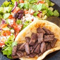 Gyro Deluxe · Gyro meat on pita with tzatziki and served with a small Greek salad.
