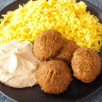 Falafel Plate · 4 garbanzo and parsley balls, fried and spiced with cumin. Served with 2 choices of hummus, ...
