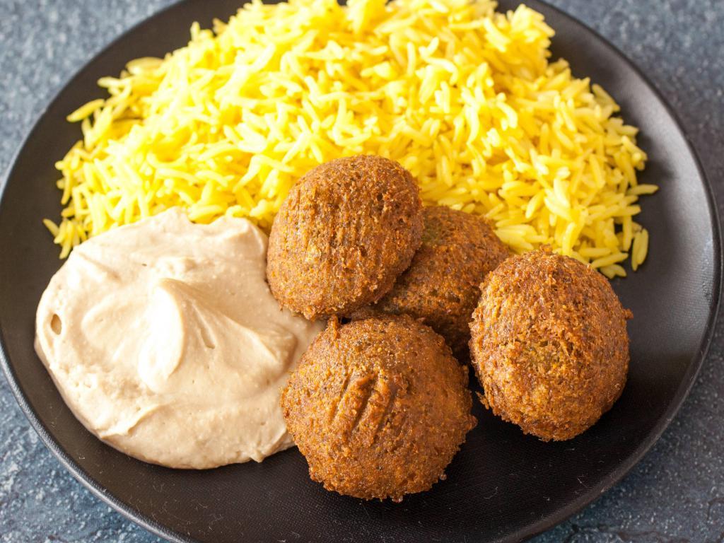 Falafel Plate · 4 garbanzo and parsley balls, fried and spiced with cumin. Served with 2 choices of hummus, house salad, motobal baba ganoush and rice.