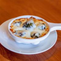 Escargot · Snails baked in garlic and parsley butter served in special escargot dish.
