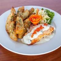 Salmon Filet · Grilled salmon filet with red caviar sauce served with herbed fried potato and salad.