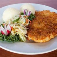 Chicken Schnitzel · Pounded meat fried in light bread crumbs served with mashed potatoes and petit salad.