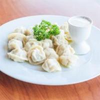 20 Piece Chicken Pelmeni · Plump meat ravioli filled with minced chicken and onion and served with sour cream.