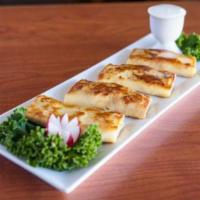 Blini Meat and Cheese · 4 blintzes filled with beef and mozzarella cheese.