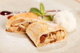 Apple Strudel · Gorgeous strudel with thin layers of flaky pastry, rolled up with lots of juicy spiced apple...