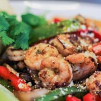 Shrimp Fajitas Plate · Grilled shrimp, bell peppers, and onions marinated with homemade chimichurri. Topped with co...