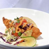 Fish Taco · Beer battered fish, cabbage, pico de gallo and chipotle sauce. Served with 1 tortilla.