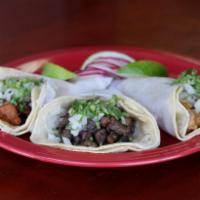 Traditional Taco · With cilantro and onion.