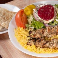 Chicken Skewers Light Meal · Souvlaki. 2 char-grilled chicken skewers over rice with a side Greek salad.