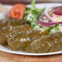 Dolmades Light Meal · 4 tender grape leaves stuffed with ground beef, rice, tomato and herbs, served with a side G...