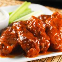 Buffalo Wings · Battered, crispy wings served hot, medium or mild with a choice of blue cheese or ranch dres...